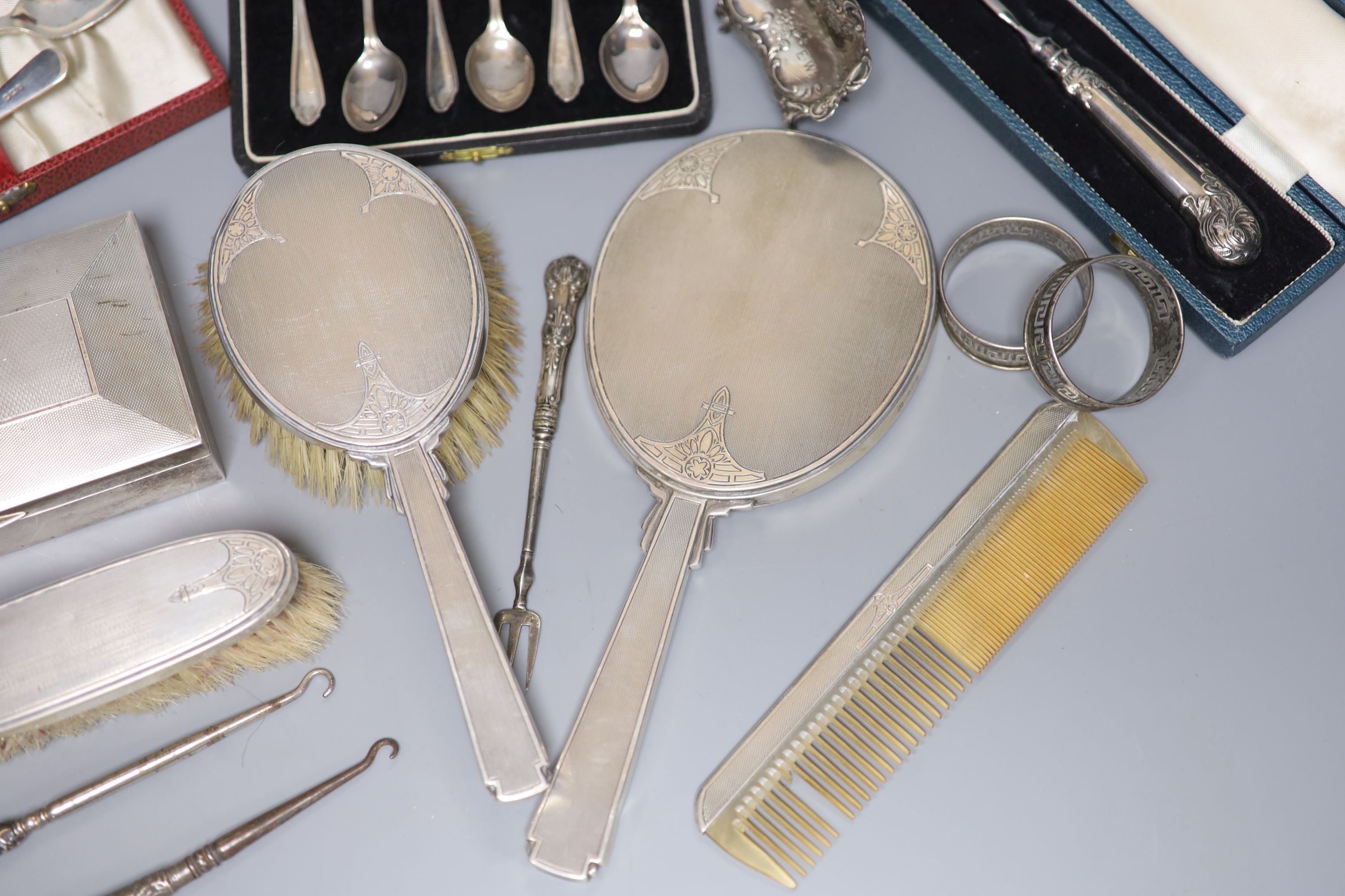 A silver cigarette case, brush set, cased spoons etc and a late Victorian miniature silver settee, Sheffield, 1897.